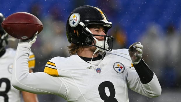 Steelers quarterback Kenny Pickett warms up before a game.